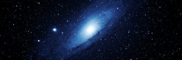 A very large blue object in the middle of the night sky